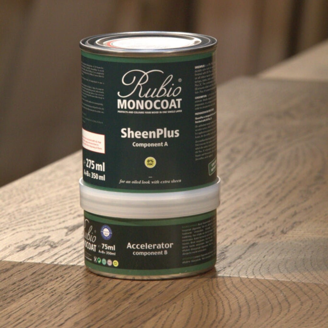 A can of Rubio Monocoat SheenPlus and Accelerator on a wooden surface.